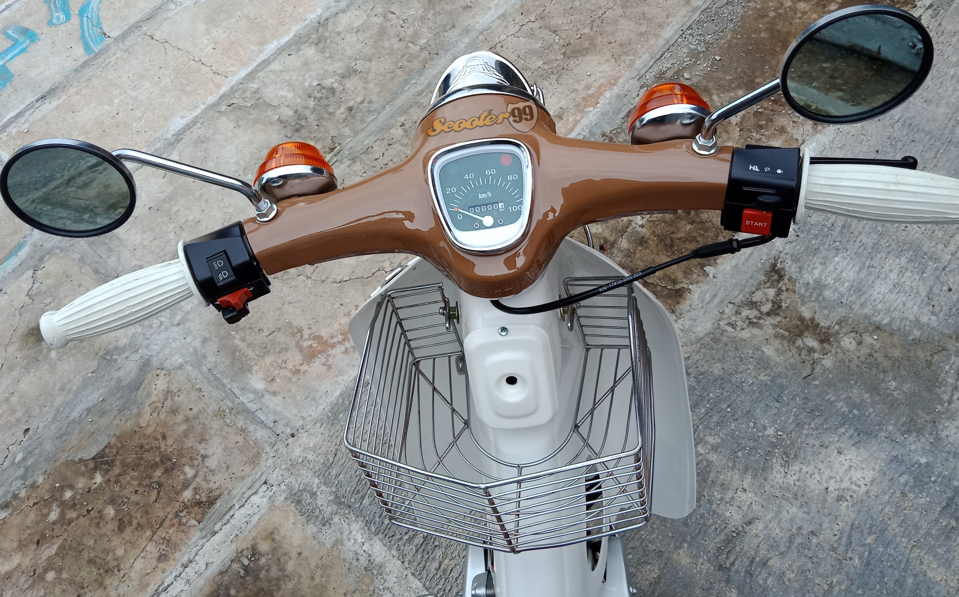 Rear angle Honda Mini Cup Brown with chrome rear rack